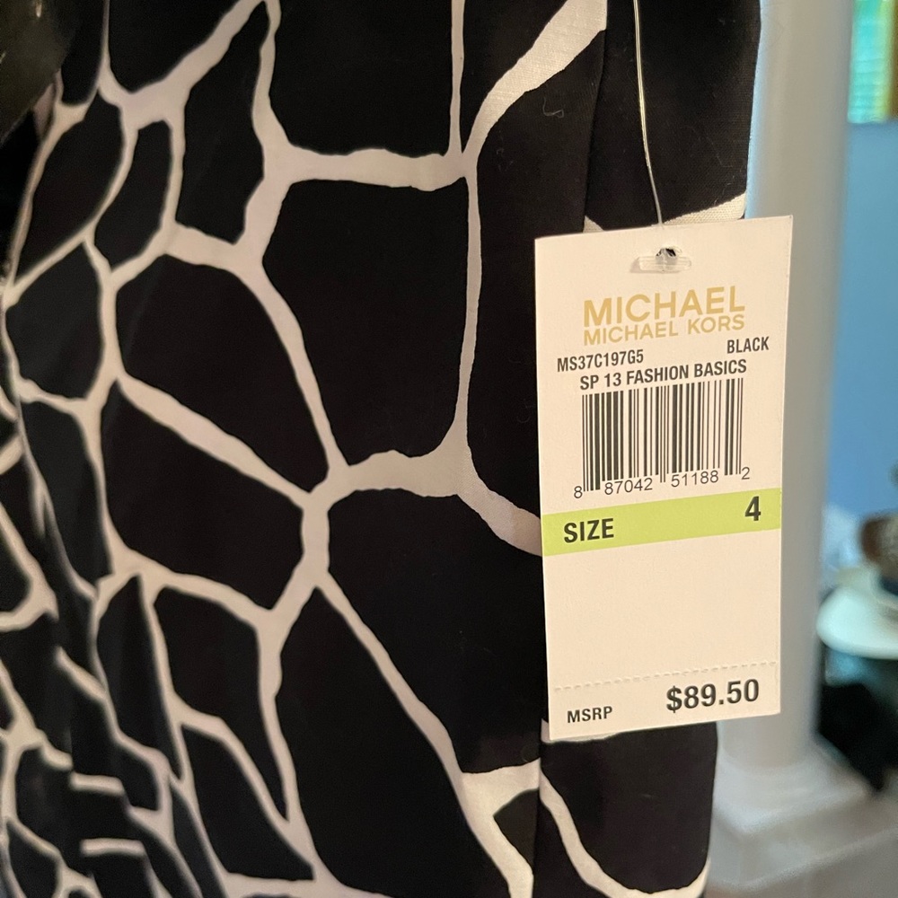 Michael Khors skirt NWT. Black and white, crisp skirt with belt.